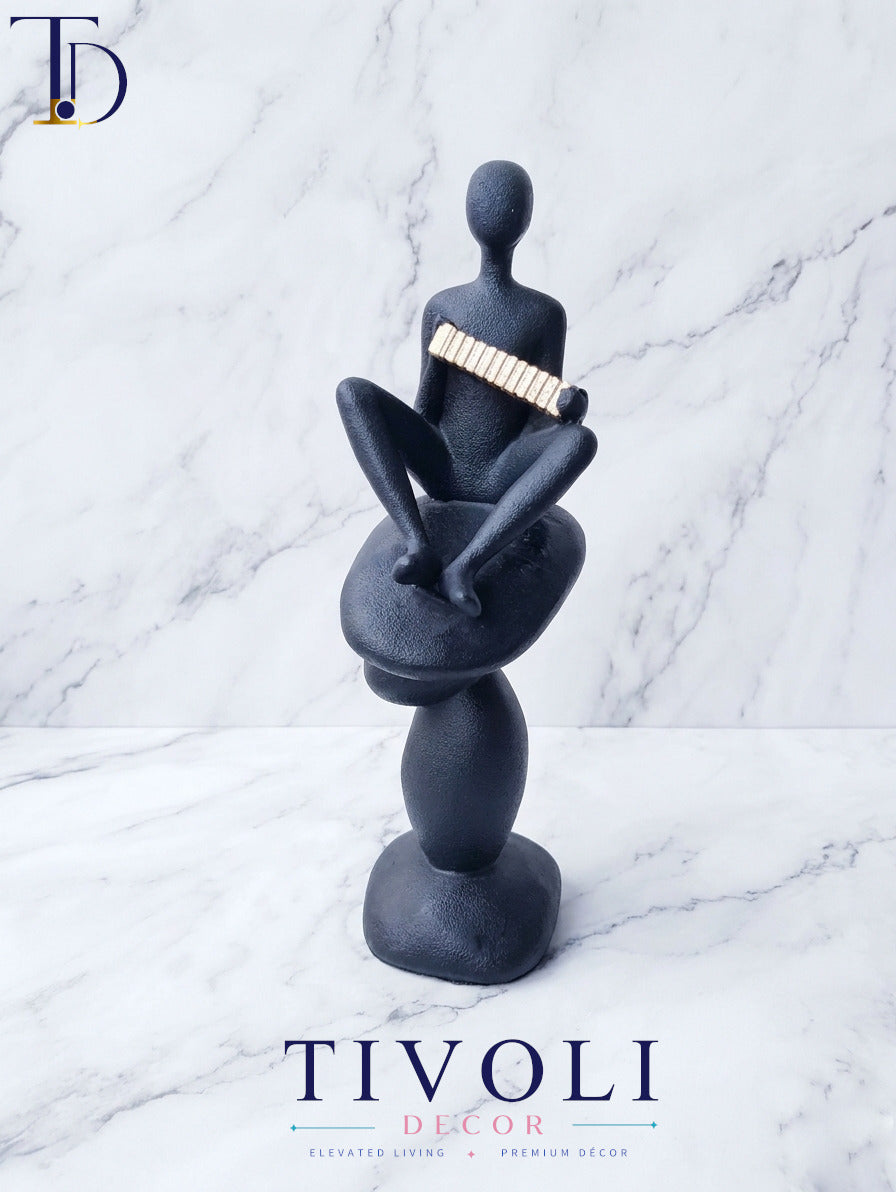 Volcanic Black Musician Statue with Golden Accordion | Premium Home Decor Pakistan
