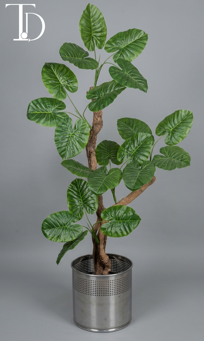 Branded Tivoli Decor premium artificial elephant ear alocasia tree with lush green textured leaves and a realistic faux wood trunk against a neutral grey studio background.