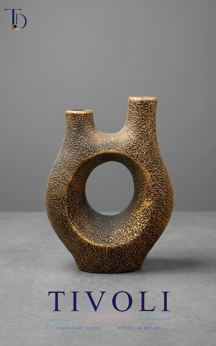 Rustic volcano textured dual spout ceramic vase by Tivoli Decor, a premium abstract decoration piece for living room console tables in Pakistan.Close-up showing the volcanic granular lava texture and gold-burnished finish on the double spout resin sculpture vase by Tivoli Decor.