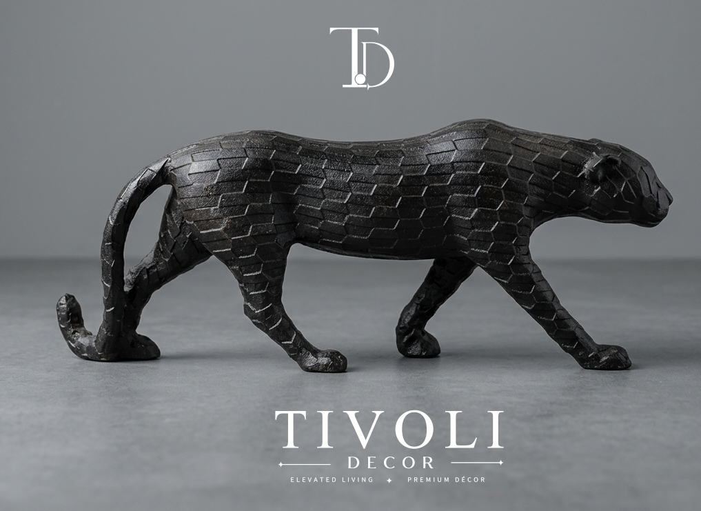 Geometric prowling tiger sculpture in matte black finish - Tivoli Decor. Modern geometric matte black cheetah statue by Tivoli Decor, a premium abstract decoration piece for living room TV consoles in Pakistan.