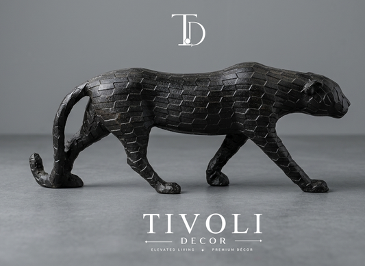 Geometric prowling tiger sculpture in matte black finish - Tivoli Decor. Modern geometric matte black cheetah statue by Tivoli Decor, a premium abstract decoration piece for living room TV consoles in Pakistan.