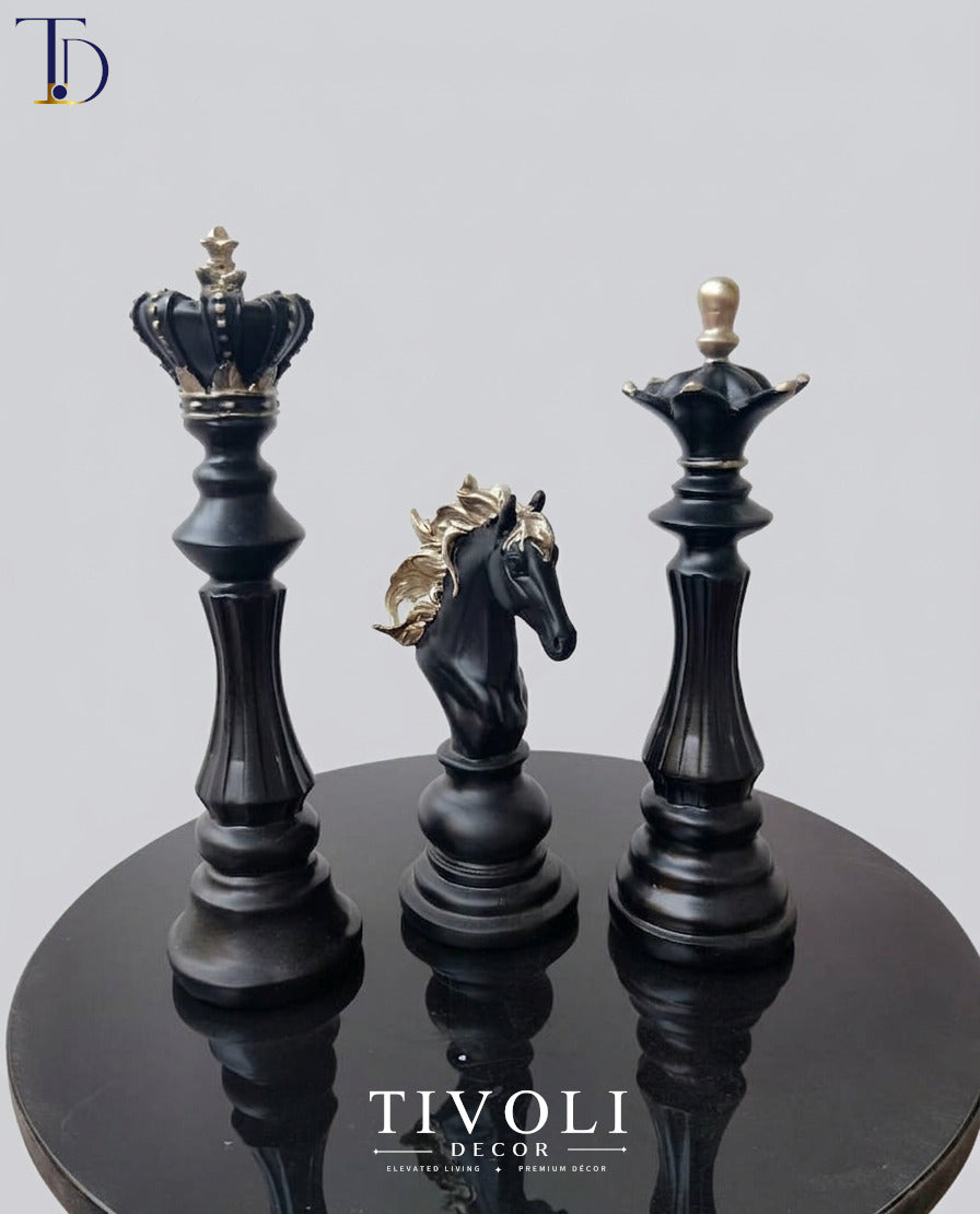 Minimalist king, queen, and knight black and gold chess statue set by Tivoli Decor, a premium abstract table decoration piece for luxury living rooms in Pakistan.