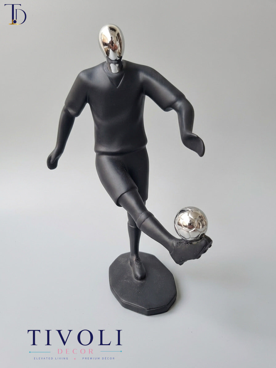 Modern matte black and chrome silver football player statue by Tivoli Decor, a premium abstract sports decoration piece for study desks in Pakistan.