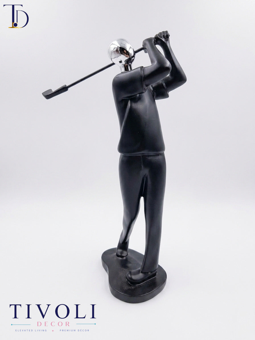 Modern matte black and chrome silver golfer statue with golf club follow-through by Tivoli Decor, a premium abstract sports decoration piece for office desks in Pakistan.