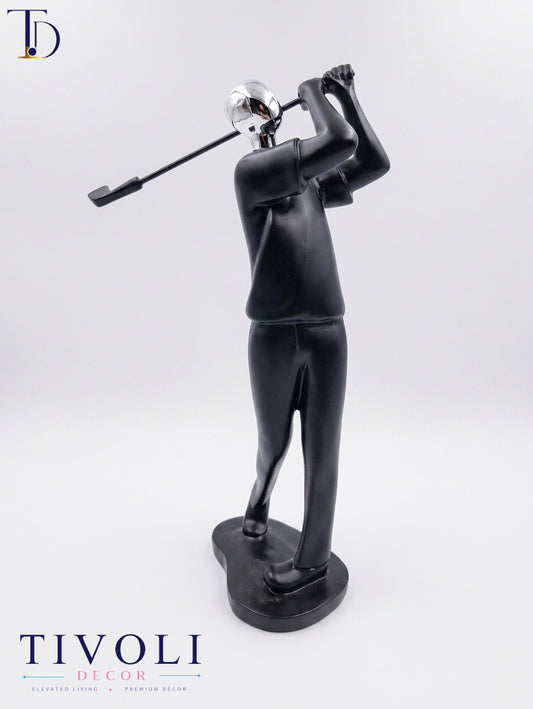 Modern matte black and chrome silver golfer statue with golf club follow-through by Tivoli Decor, a premium abstract sports decoration piece for office desks in Pakistan.