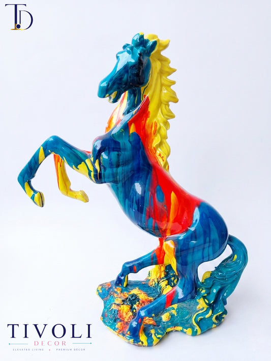 Make an unforgettable, vibrant statement in your space with the Abstract Fluid Art Multi-Color Rearing Horse Statue, brought to you exclusively by Tivoli Decor. 