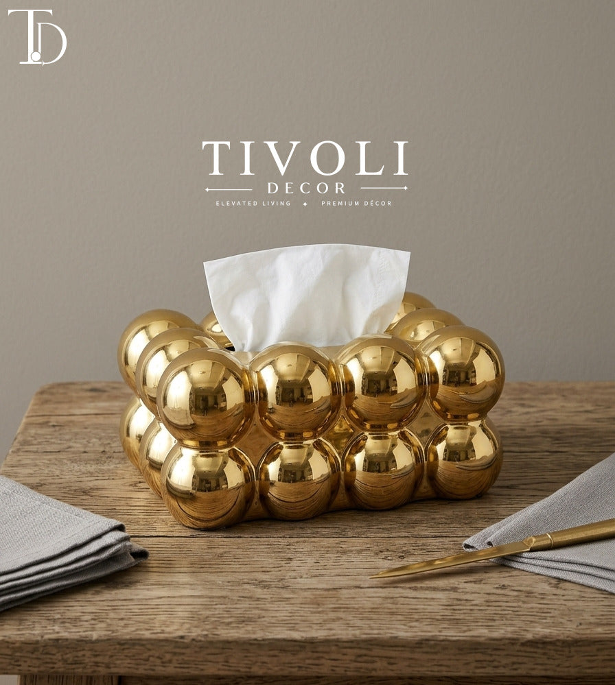 Tivoli Decor luxury metallic gold ceramic tissue box cover with modern bubble puff pattern styled on a wooden tabletop setting in a premium Pakistani home.