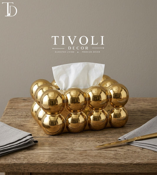 Tivoli Decor luxury metallic gold ceramic tissue box cover with modern bubble puff pattern styled on a wooden tabletop setting in a premium Pakistani home.