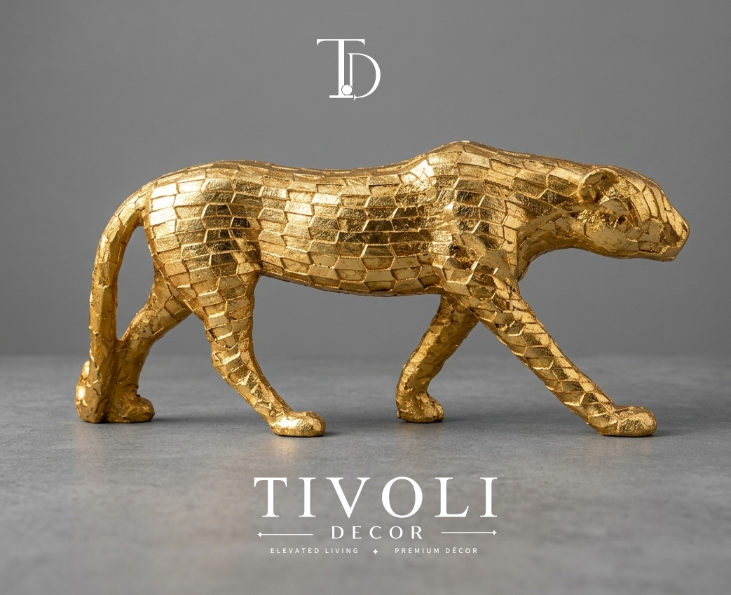 Modern geometric metallic golden cheetah statue by Tivoli Decor, a premium abstract decoration piece for living room TV consoles in Pakistan.Close-up showing the faceted brick-like geometric skin texture and shiny gold leaf finish on the cheetah sculpture by Tivoli Decor.