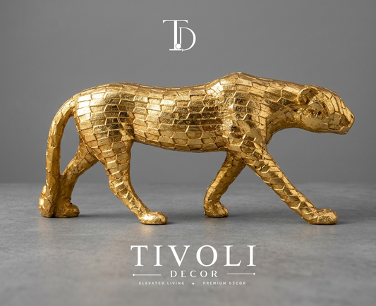 Modern geometric metallic golden cheetah statue by Tivoli Decor, a premium abstract decoration piece for living room TV consoles in Pakistan.Close-up showing the faceted brick-like geometric skin texture and shiny gold leaf finish on the cheetah sculpture by Tivoli Decor.