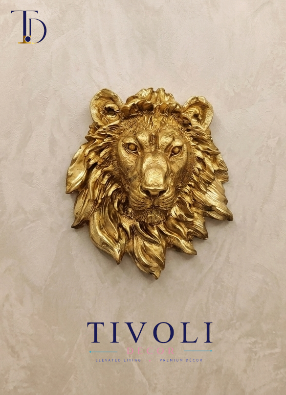 Royal metallic golden lion head 3D wall sculpture by Tivoli Decor, a premium abstract decoration piece mounted on a textured beige wall in Pakistan.