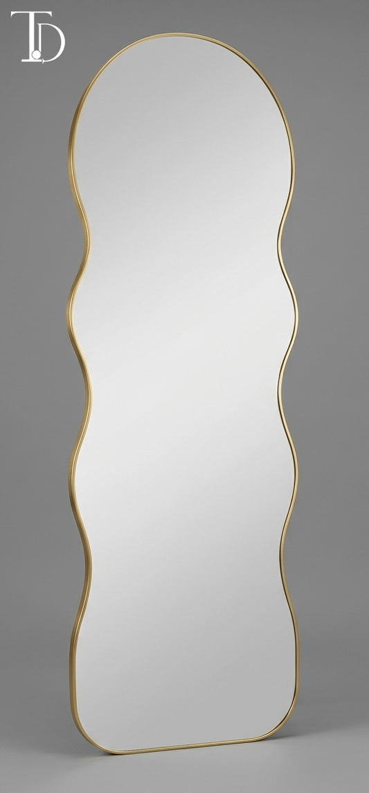 Branded Tivoli Decor modern wavy full-length floor mirror featuring an irregular asymmetrical silhouette with a slim brushed gold metal frame.