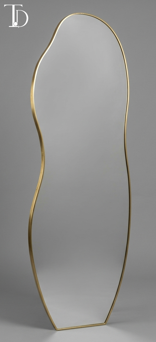 Branded Tivoli Decor Oasis irregular full-length floor mirror featuring an organic asymmetrical silhouette with a slim brushed gold metal frame.