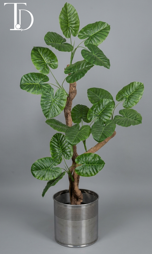 Branded Tivoli Decor premium artificial elephant ear alocasia tree with lush green textured leaves and a realistic faux wood trunk against a neutral grey studio background.