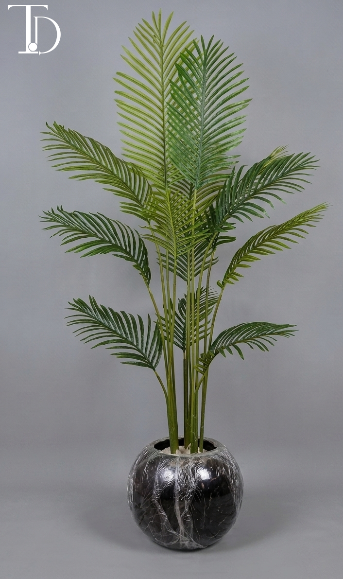 Branded Tivoli Decor luxury artificial cycas sago palm tree with structured green fronds standing in a glossy black spherical orb planter against a grey studio background.