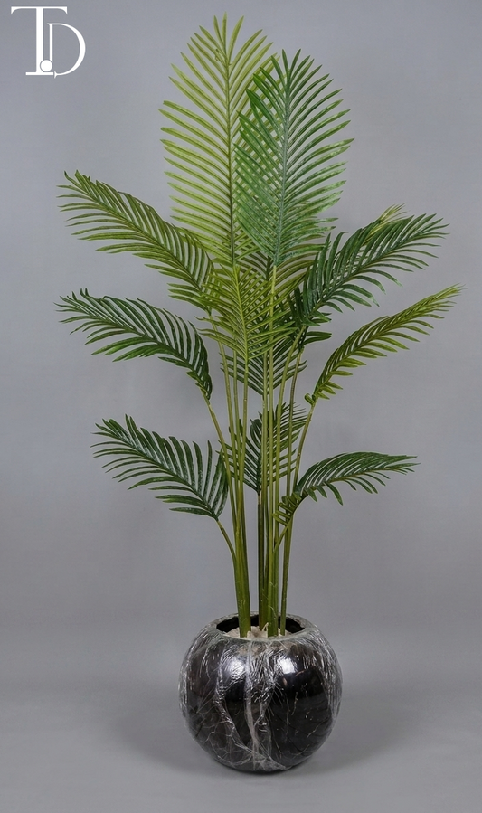 Branded Tivoli Decor luxury artificial cycas sago palm tree with structured green fronds standing in a glossy black spherical orb planter against a grey studio background.