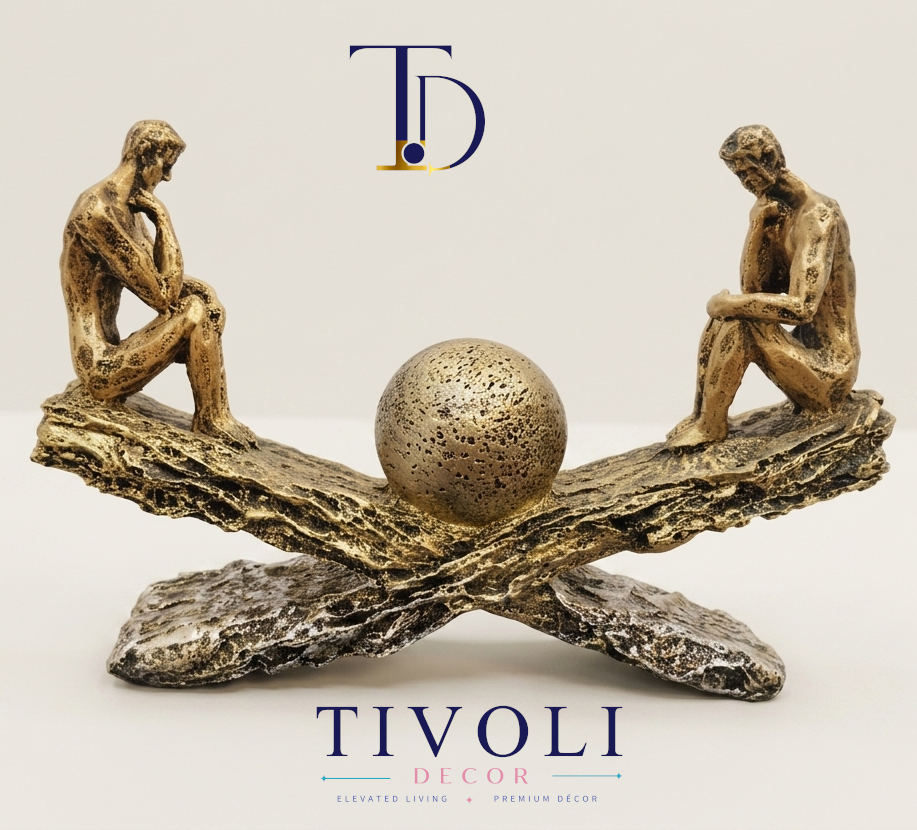 Abstract bronze "The Thinker" seesaw statue by Tivoli Decor, a premium luxury decoration piece for living room console tables in Pakistan.Close-up showing the textured bronze finish and detailed thinking figures on the horizontal seesaw sculpture by Tivoli Decor.