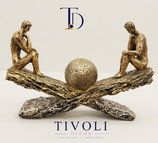 Abstract bronze "The Thinker" seesaw statue by Tivoli Decor, a premium luxury decoration piece for living room console tables in Pakistan.Close-up showing the textured bronze finish and detailed thinking figures on the horizontal seesaw sculpture by Tivoli Decor.