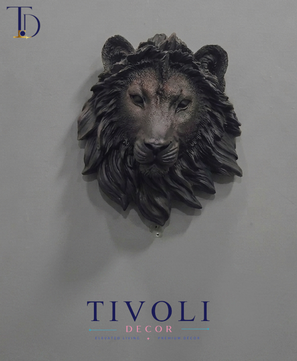 Modern matte black lion head 3D wall sculpture by Tivoli Decor, a premium abstract decoration piece mounted on a gray wall in Pakistan.