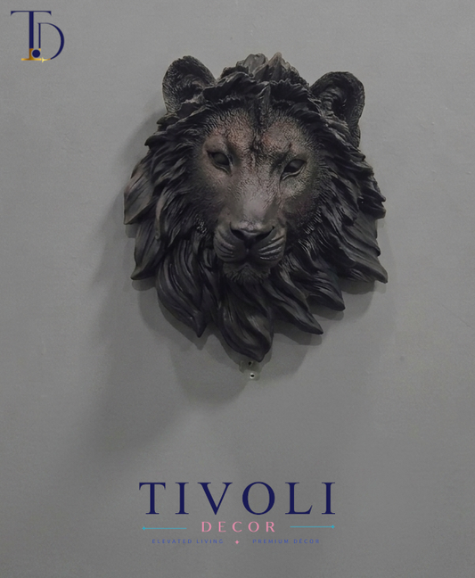 Modern matte black lion head 3D wall sculpture by Tivoli Decor, a premium abstract decoration piece mounted on a gray wall in Pakistan.